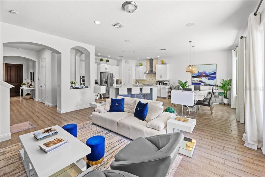 8746 Crescendo Avenue Windermere, FL 34786 - Photo 9 of 56 a living room with furniture and wooden floor