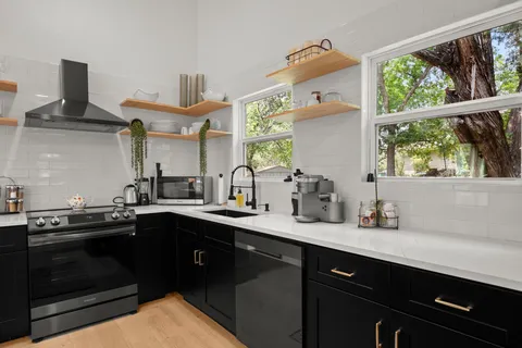 a kitchen with a sink and cabinets