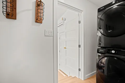 a view of a storage & utility room with a fan