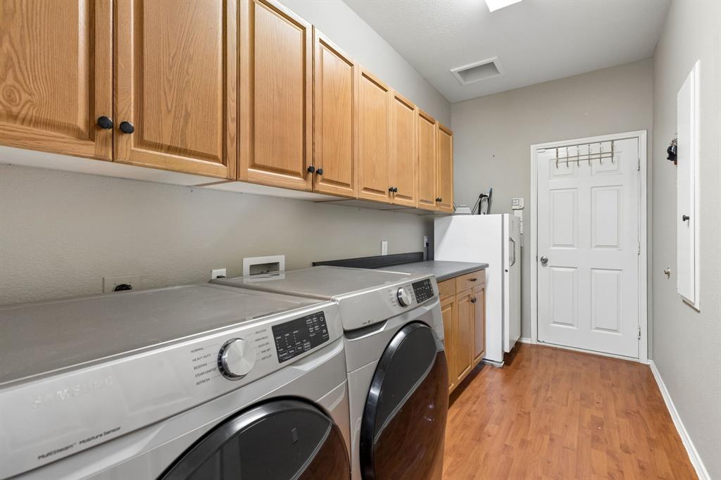 129 Timberbluff Lane Murphy, TX 75094 - Photo 33 of 34 a utility room with dryer and washer