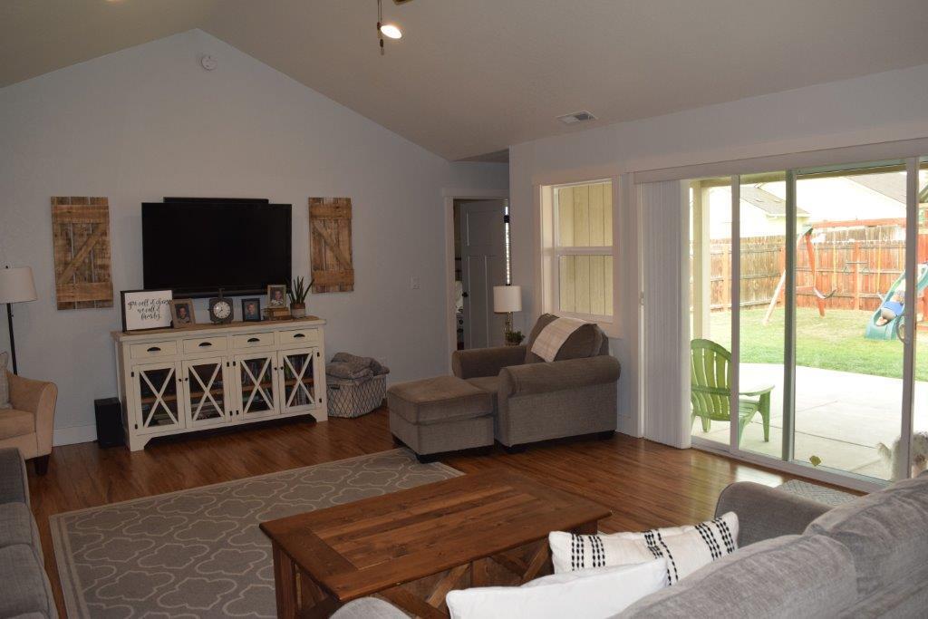 906 Win Way Eagle Point, OR 97524 - Photo 16 of 33 a living room with furniture and a flat screen tv