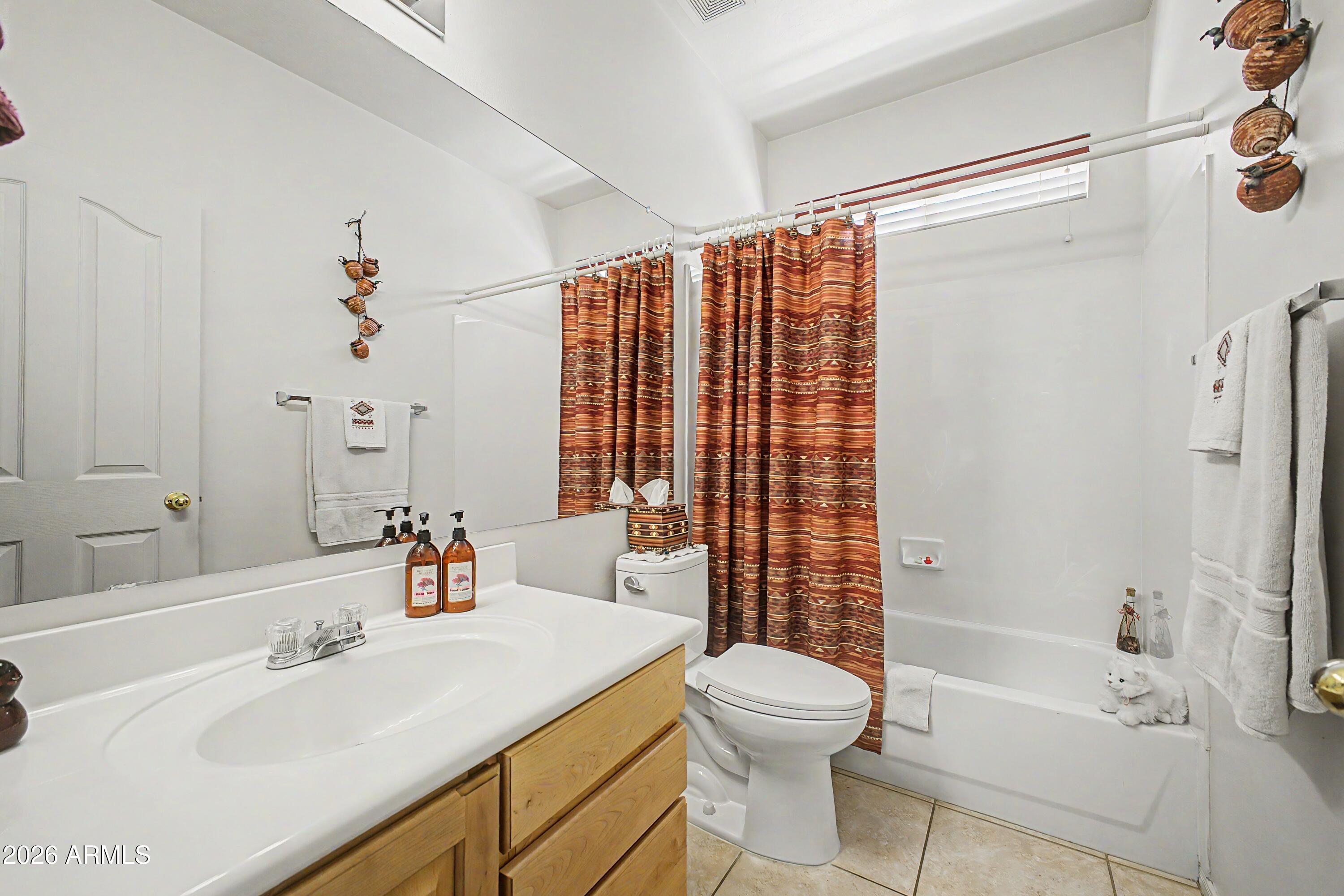 433 West Desert Avenue Gilbert, AZ 85233 - Photo 15 of 23 a bathroom with a sink toilet and shower