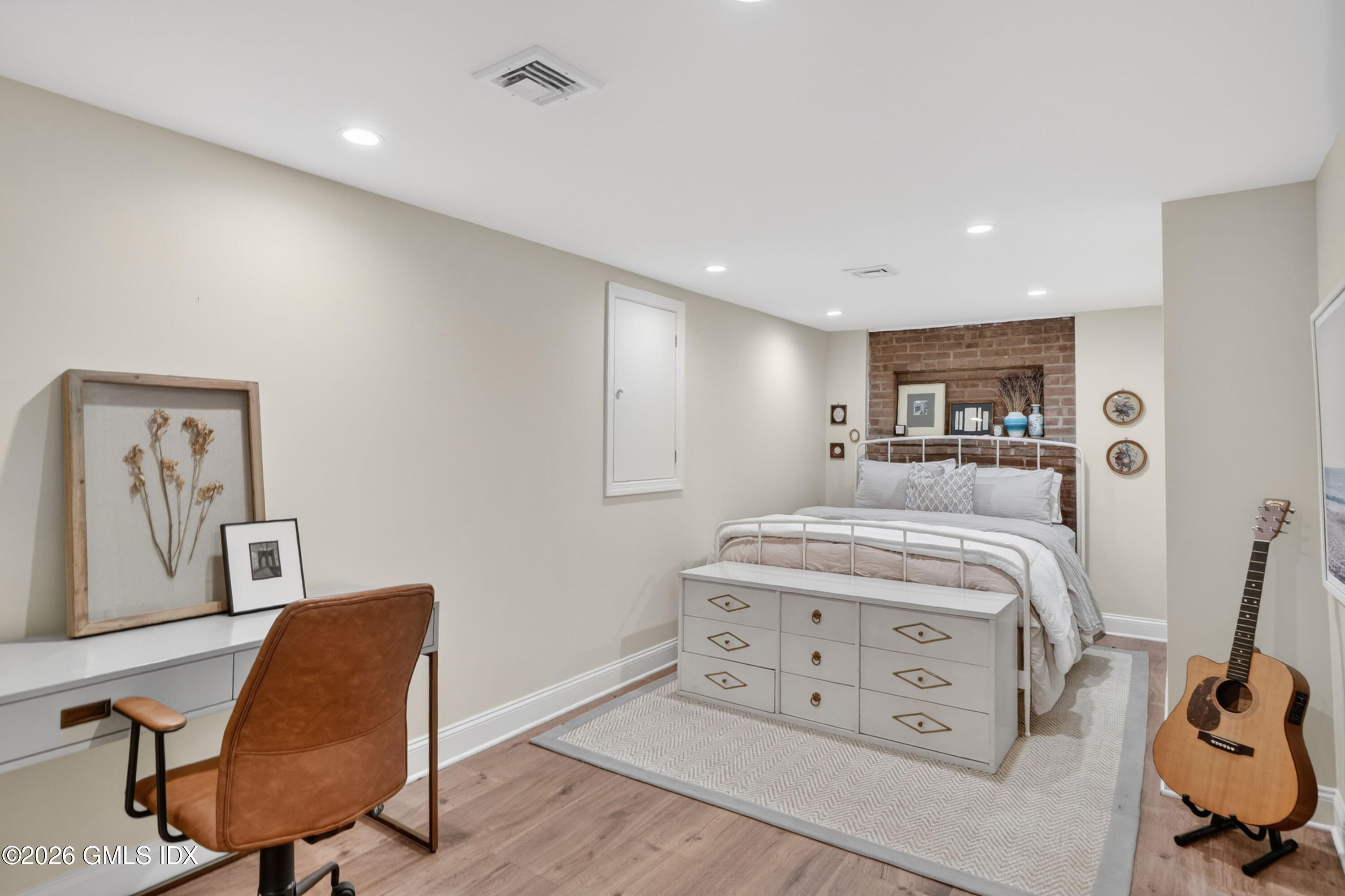 20 Ridge Road Cos Cob, CT 06807 - Photo 31 of 36 a bedroom with a bed and wooden floor