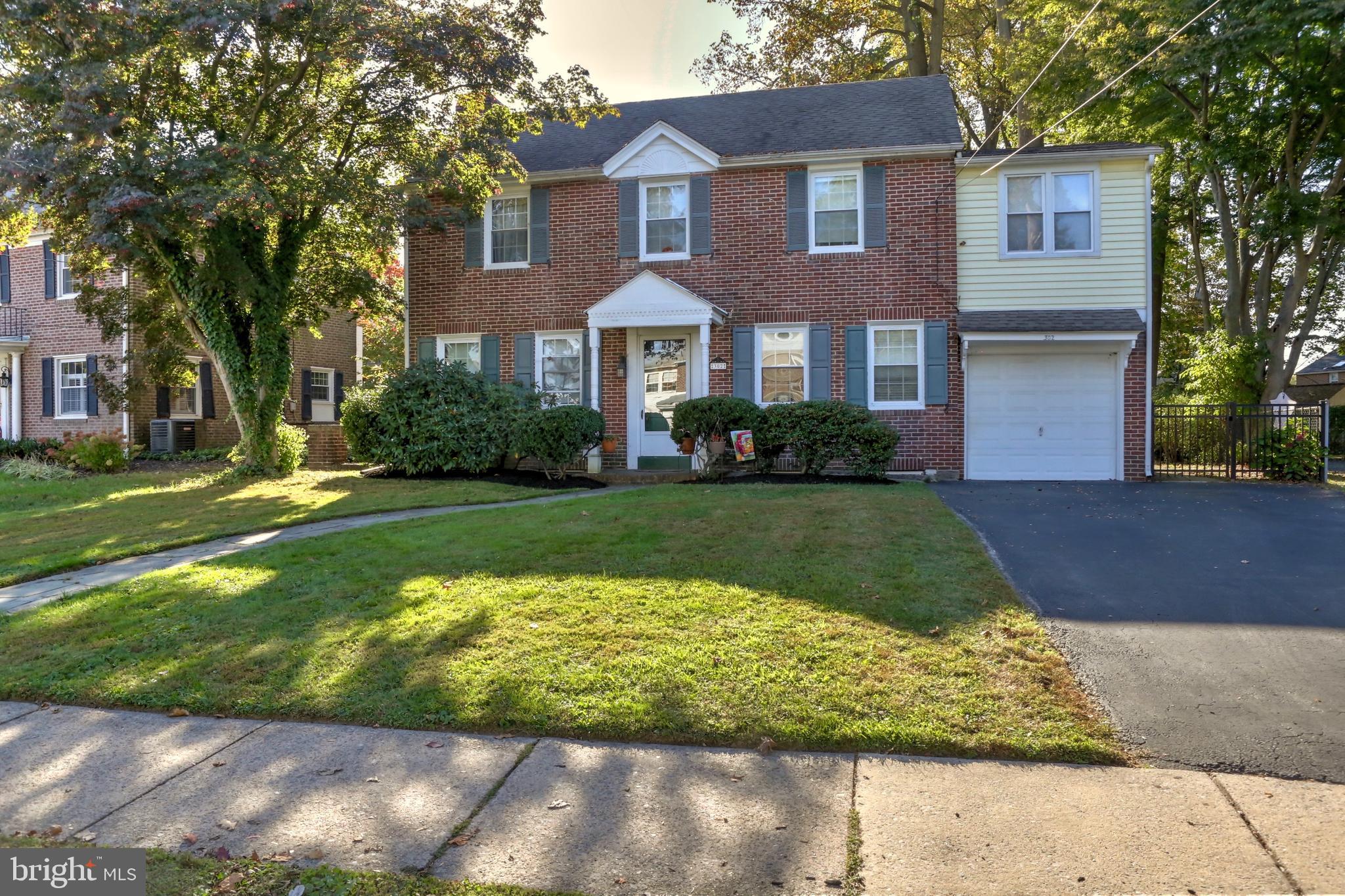 302 Shelbourne Road Havertown, PA 19083 - Photo 2 of 45 a front view of a house with a yard
