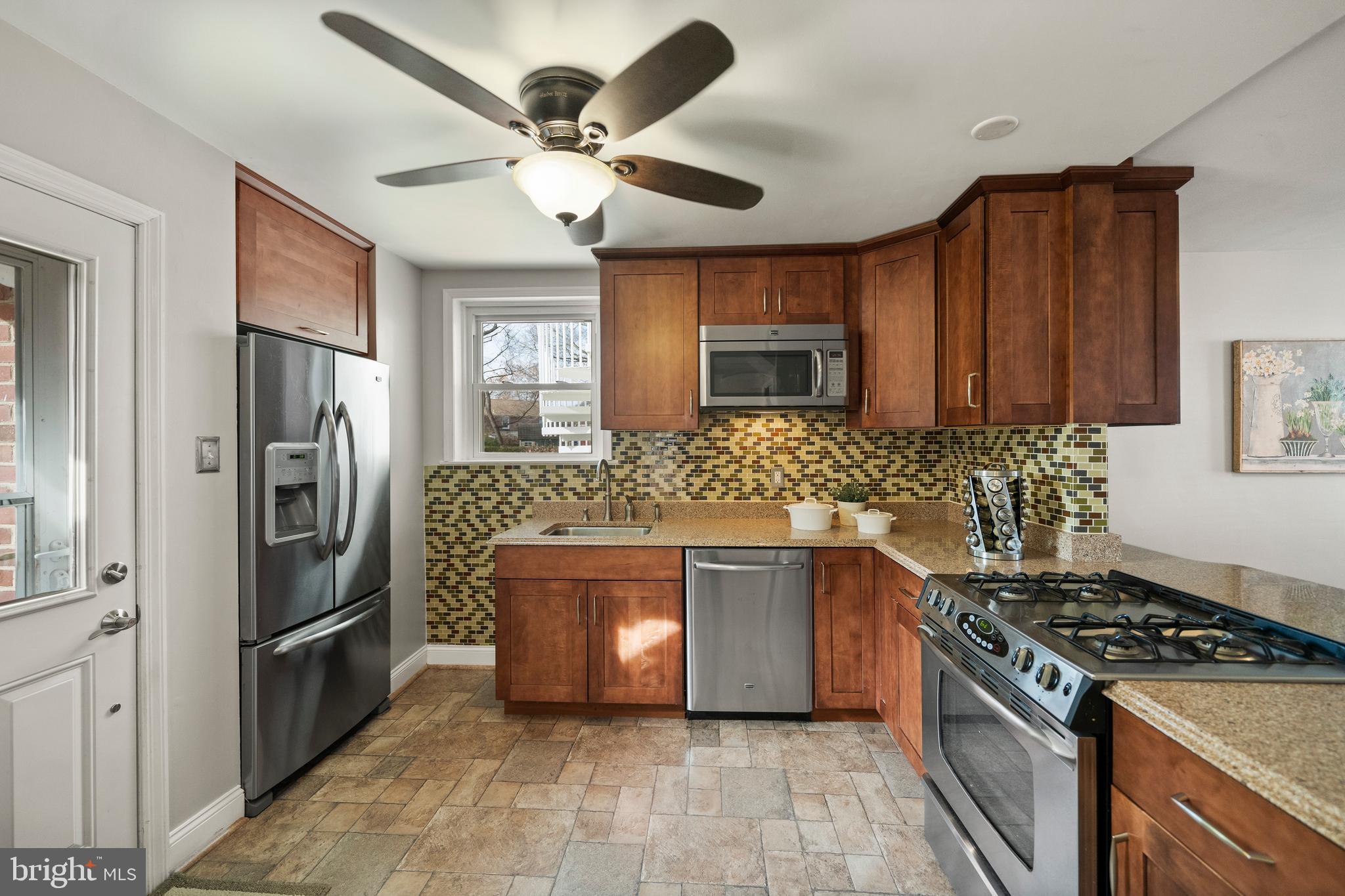 302 Shelbourne Road Havertown, PA 19083 - Photo 11 of 45 a kitchen with stainless steel appliances granite countertop a stove sink and refrigerator