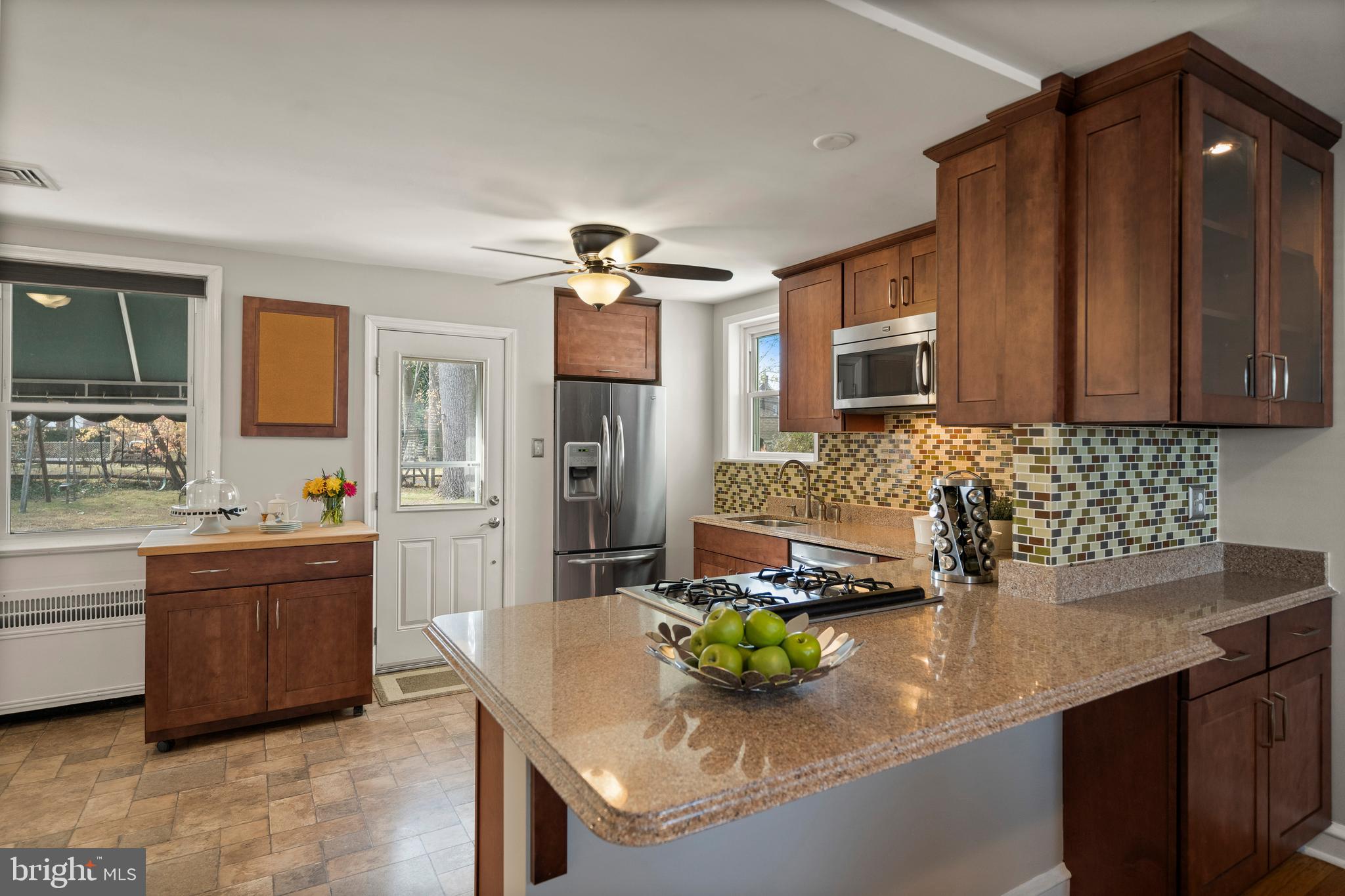 302 Shelbourne Road Havertown, PA 19083 - Photo 14 of 45 a kitchen with sink cabinets and window
