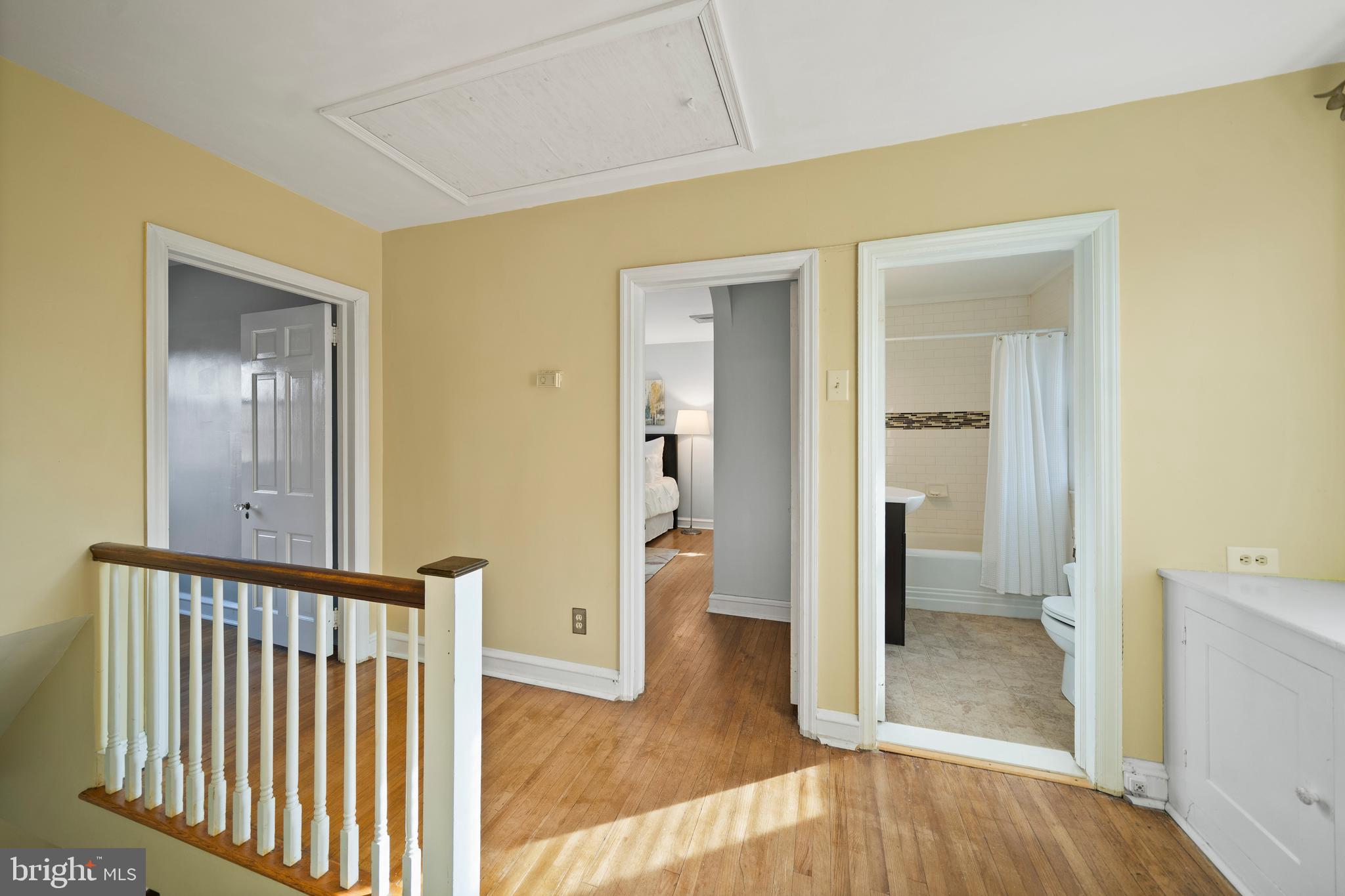 302 Shelbourne Road Havertown, PA 19083 - Photo 22 of 45 a view of a hallway with bathroom and wooden floor