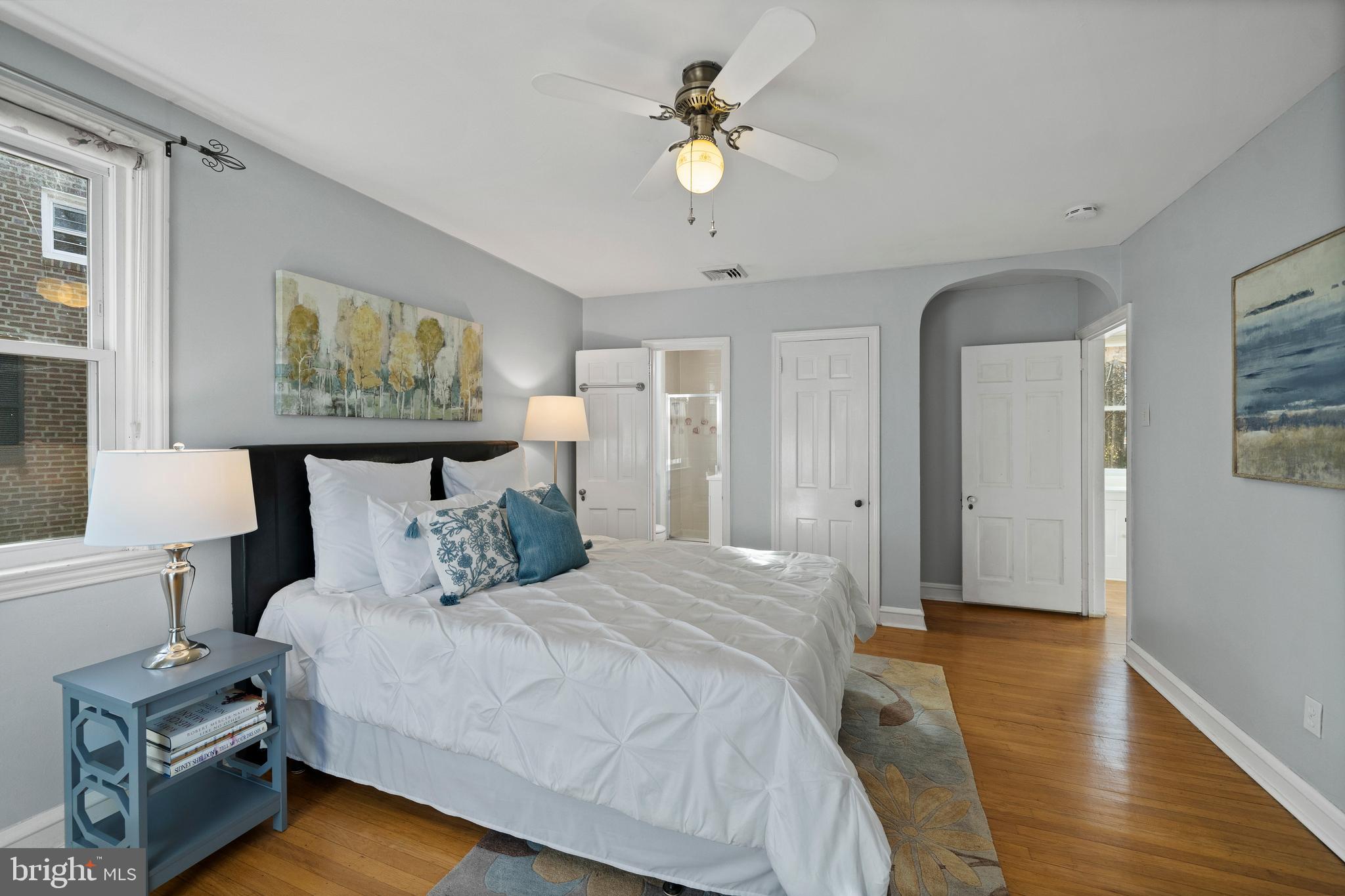 302 Shelbourne Road Havertown, PA 19083 - Photo 25 of 45 a bedroom with a large bed a chandelier and closet