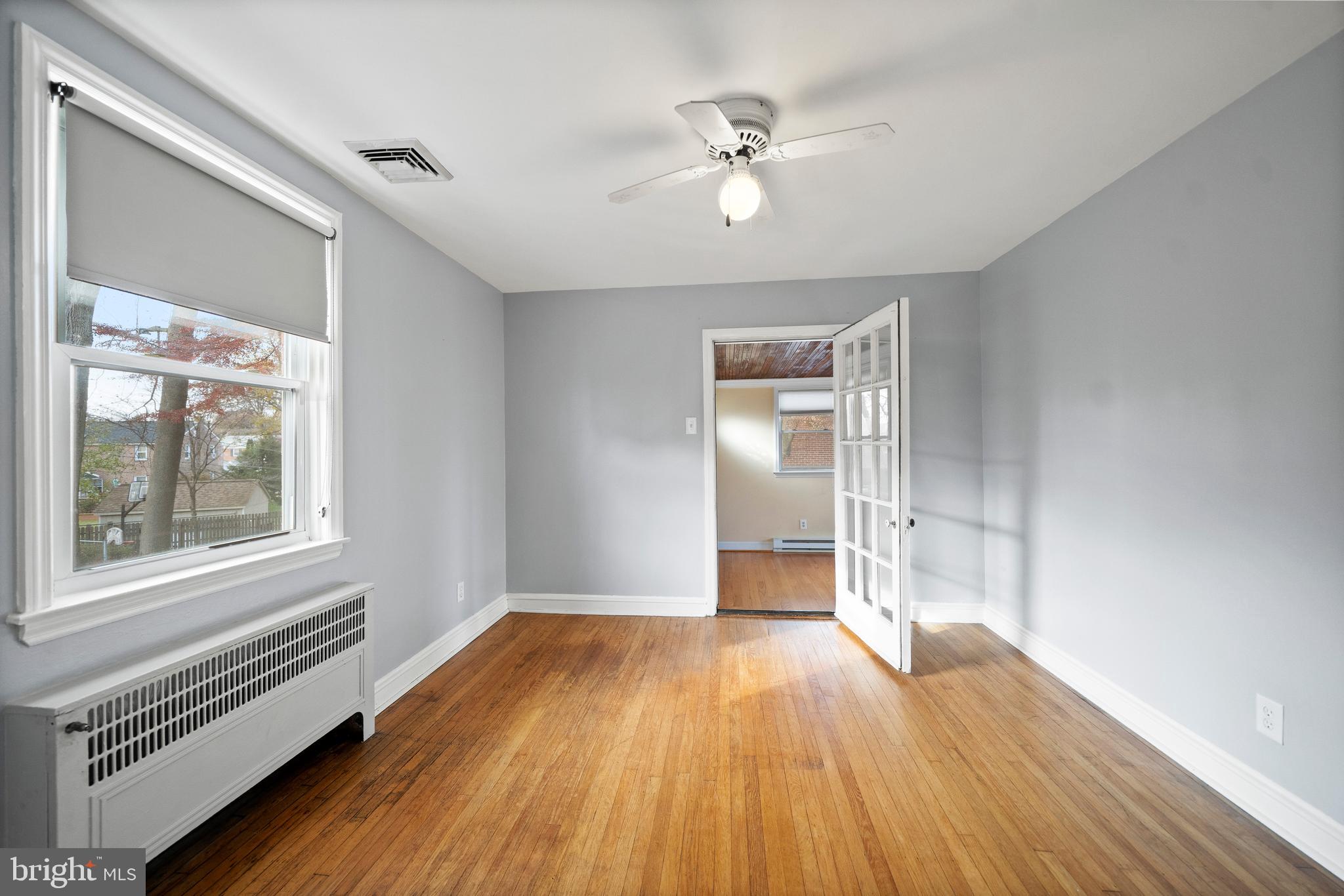 302 Shelbourne Road Havertown, PA 19083 - Photo 27 of 45 a view of empty room with wooden floor and fan