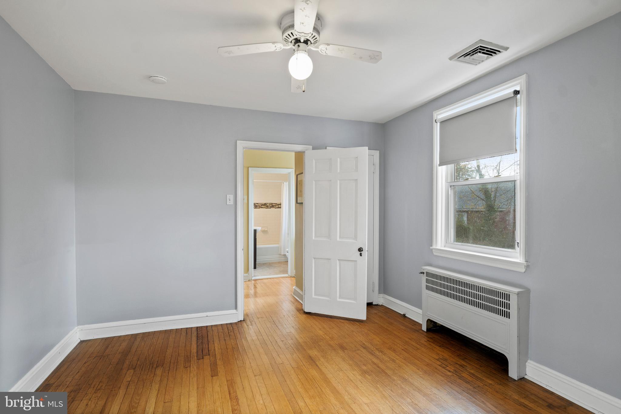 302 Shelbourne Road Havertown, PA 19083 - Photo 28 of 45 wooden floor in an empty room with a window