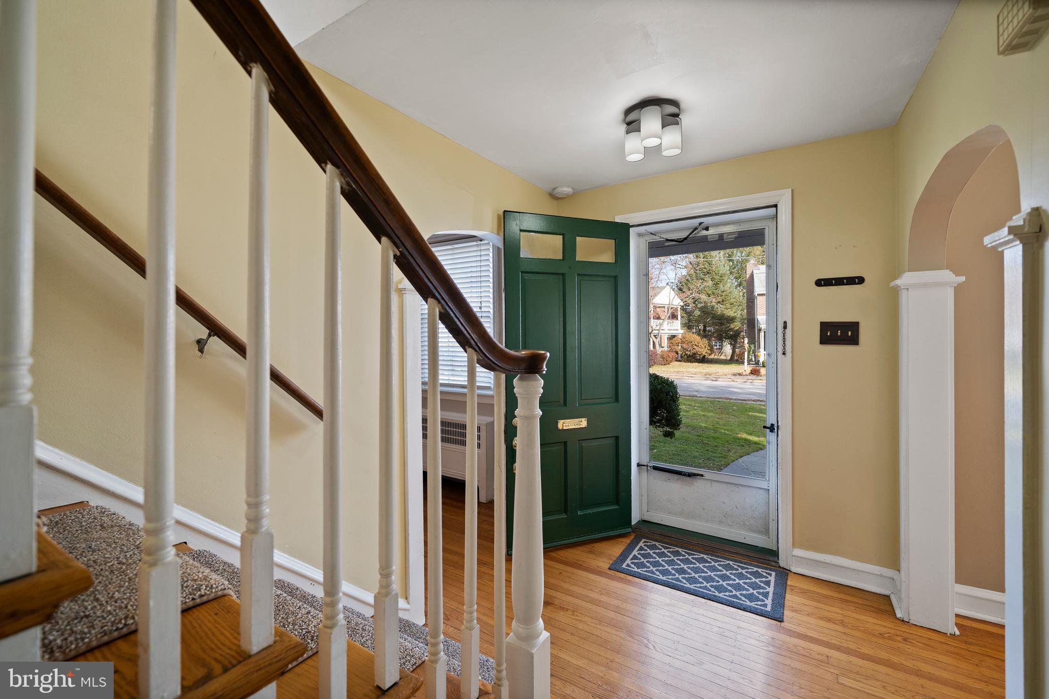 302 Shelbourne Road Havertown, PA 19083 - Photo 4 of 45 a view of entryway with wooden floor and stairs