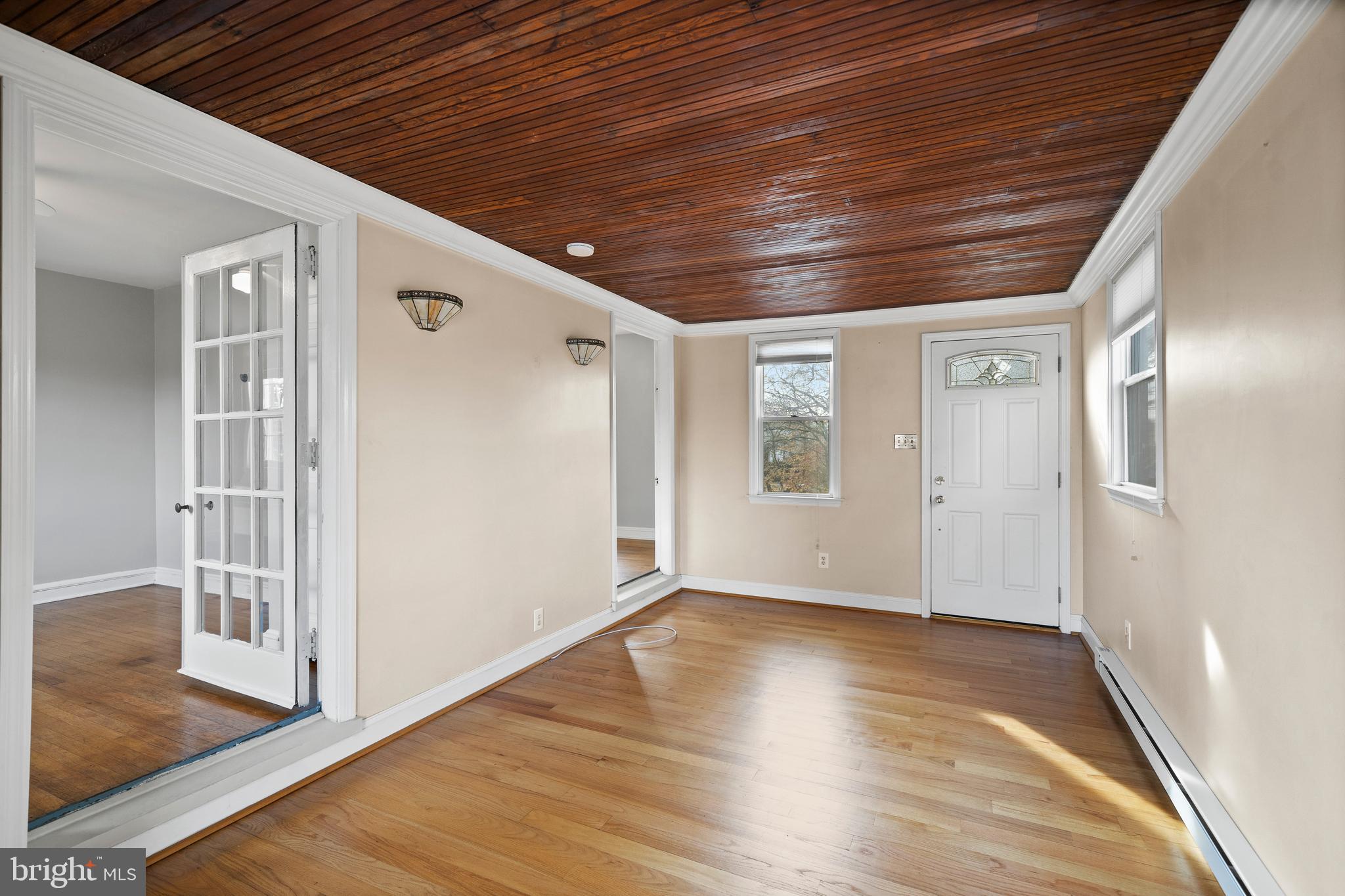302 Shelbourne Road Havertown, PA 19083 - Photo 34 of 45 a view of an empty room with wooden floor and a window