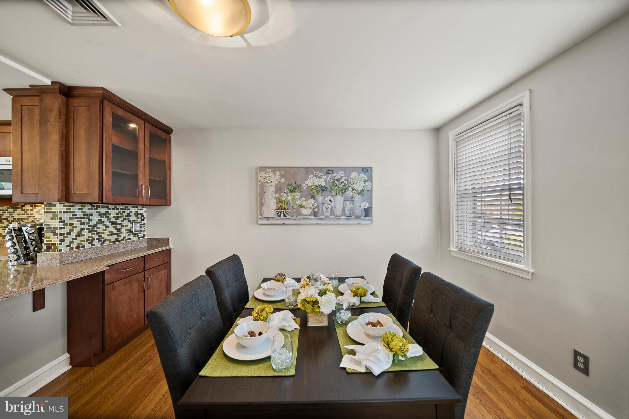 302 Shelbourne Road Havertown, PA 19083 - Photo 6 of 45 a view of a dining room with furniture a rug and wooden floor
