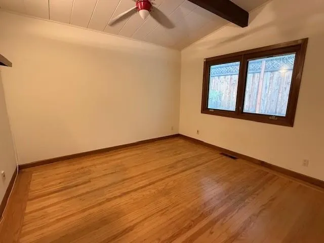 a bathroom with a granite countertop sink toilet mirror vanity and bathtub