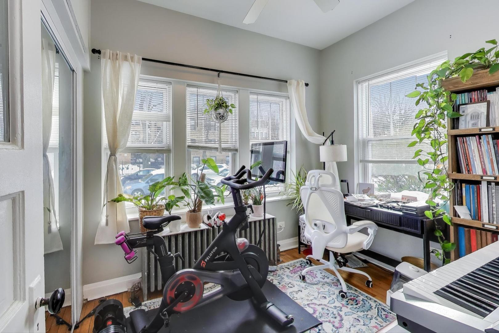 7330 North Honore Street Chicago, IL 60626 - Photo 11 of 43 a living room with furniture a rug and a window