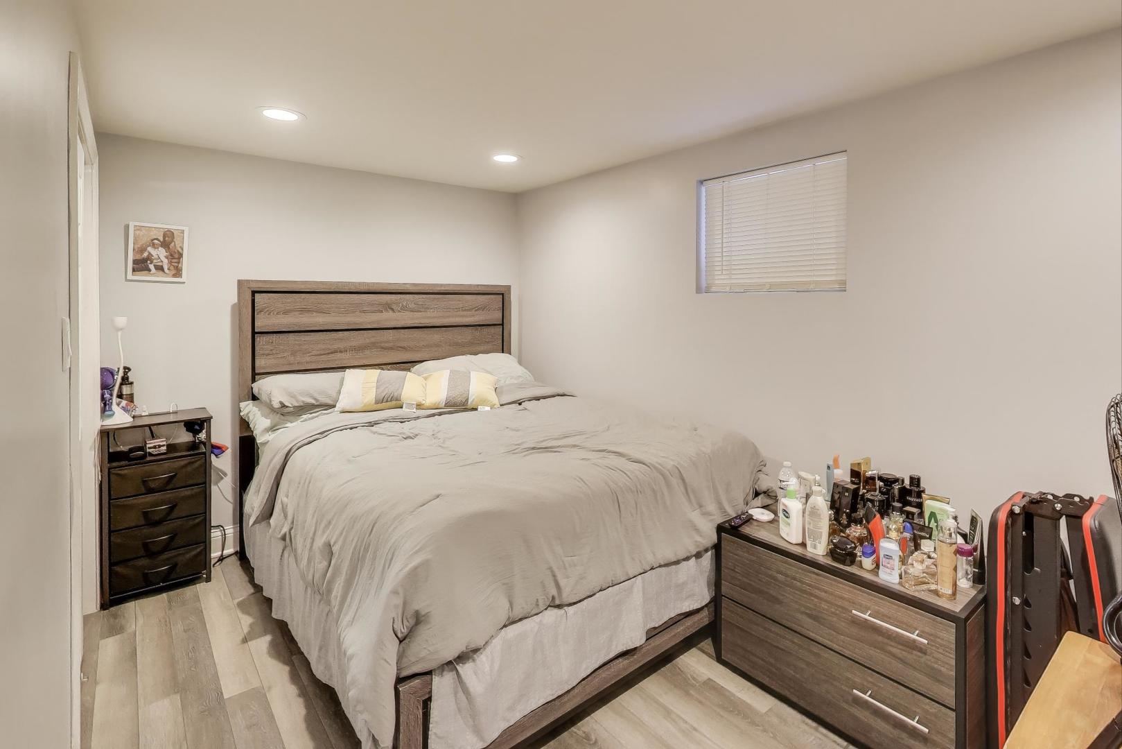 7330 North Honore Street Chicago, IL 60626 - Photo 34 of 43 a bedroom with a bed and closet