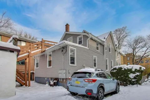 a front view of a house with parking space
