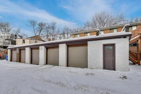 a view of a house with a snow in the yard