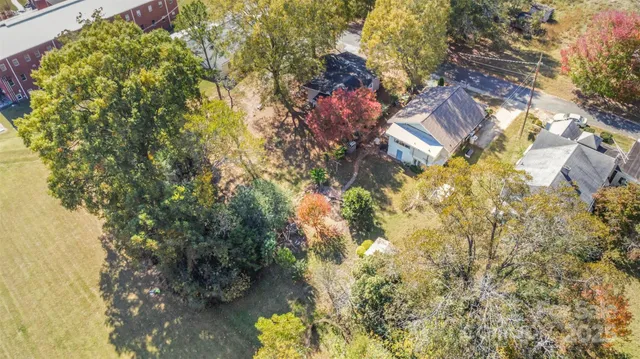 a view of a house with a tree in the background