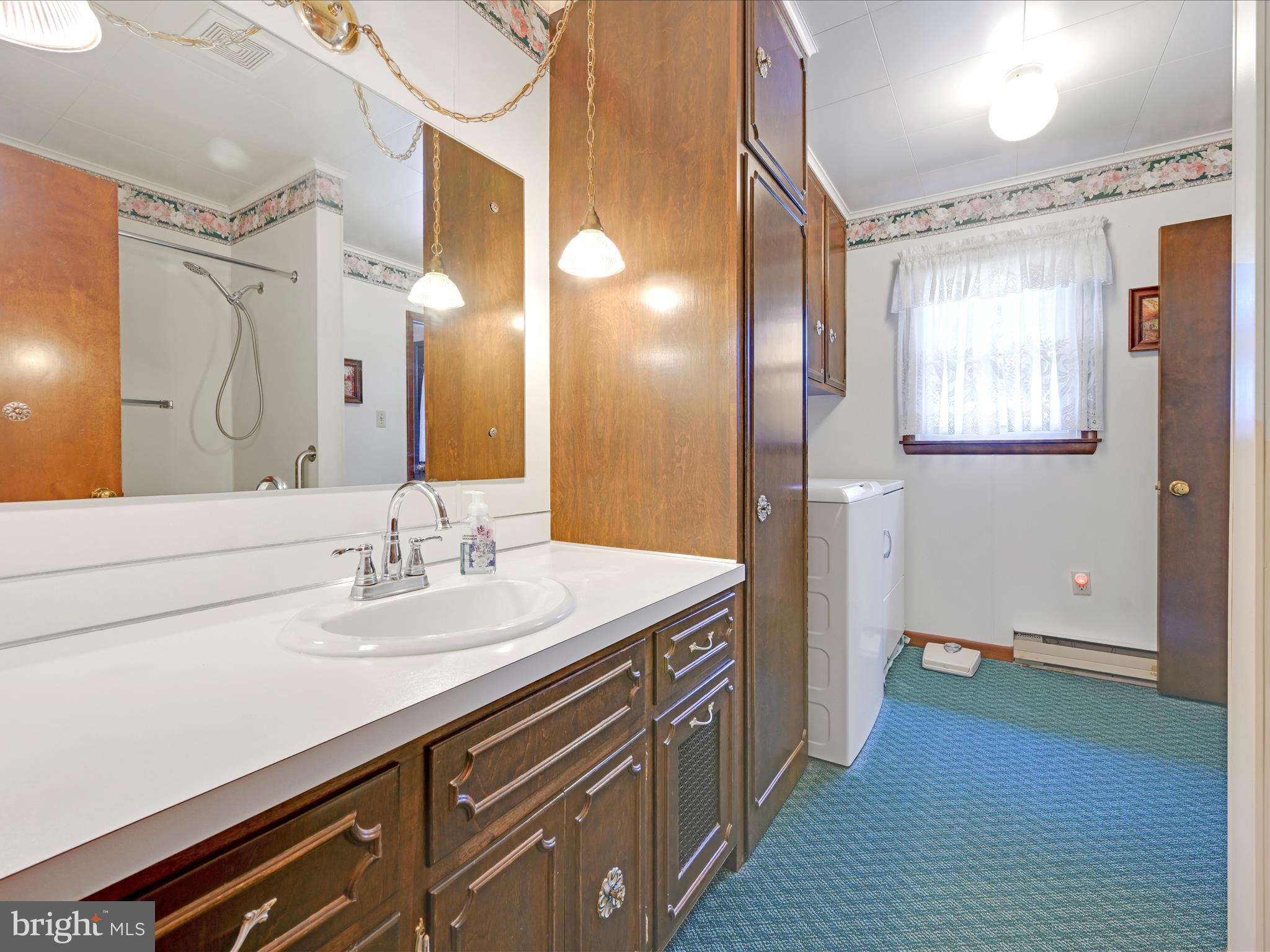 858 Hill Road Ashland, PA 17921 - Photo 16 of 41 a bathroom with a sink and a mirror