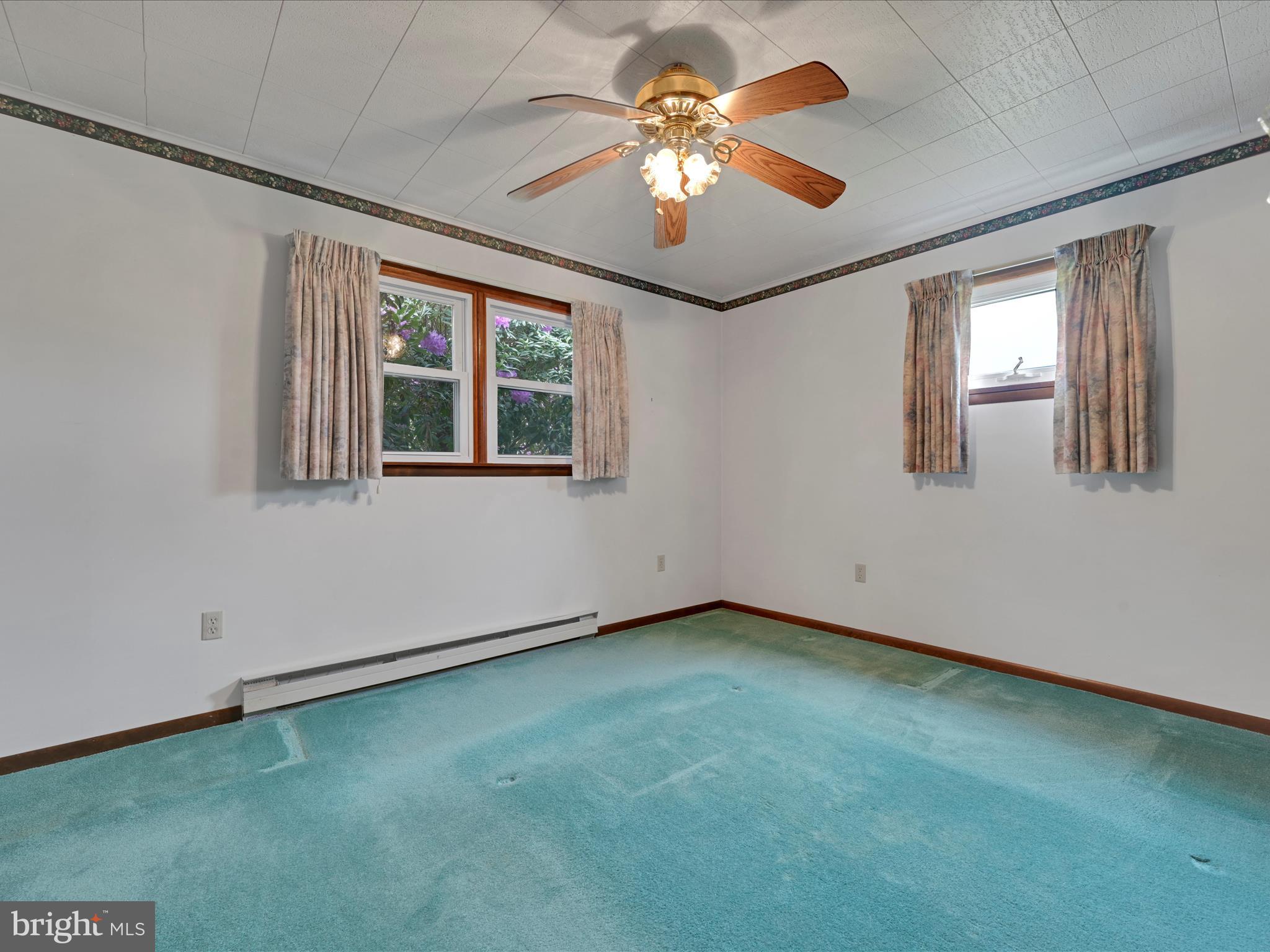 858 Hill Road Ashland, PA 17921 - Photo 17 of 41 an empty room with windows and fan