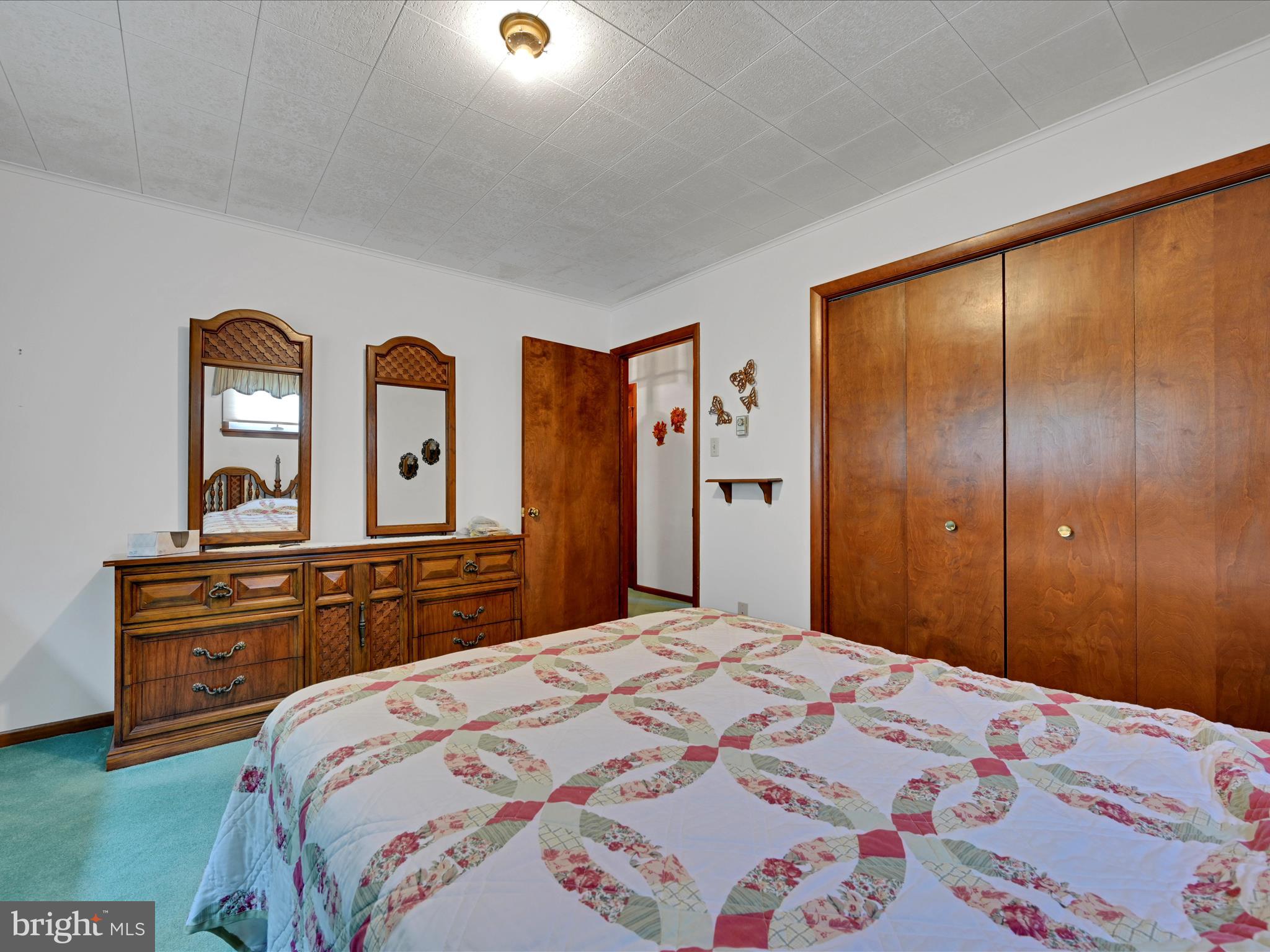 858 Hill Road Ashland, PA 17921 - Photo 20 of 41 a bedroom with a bed and a dresser