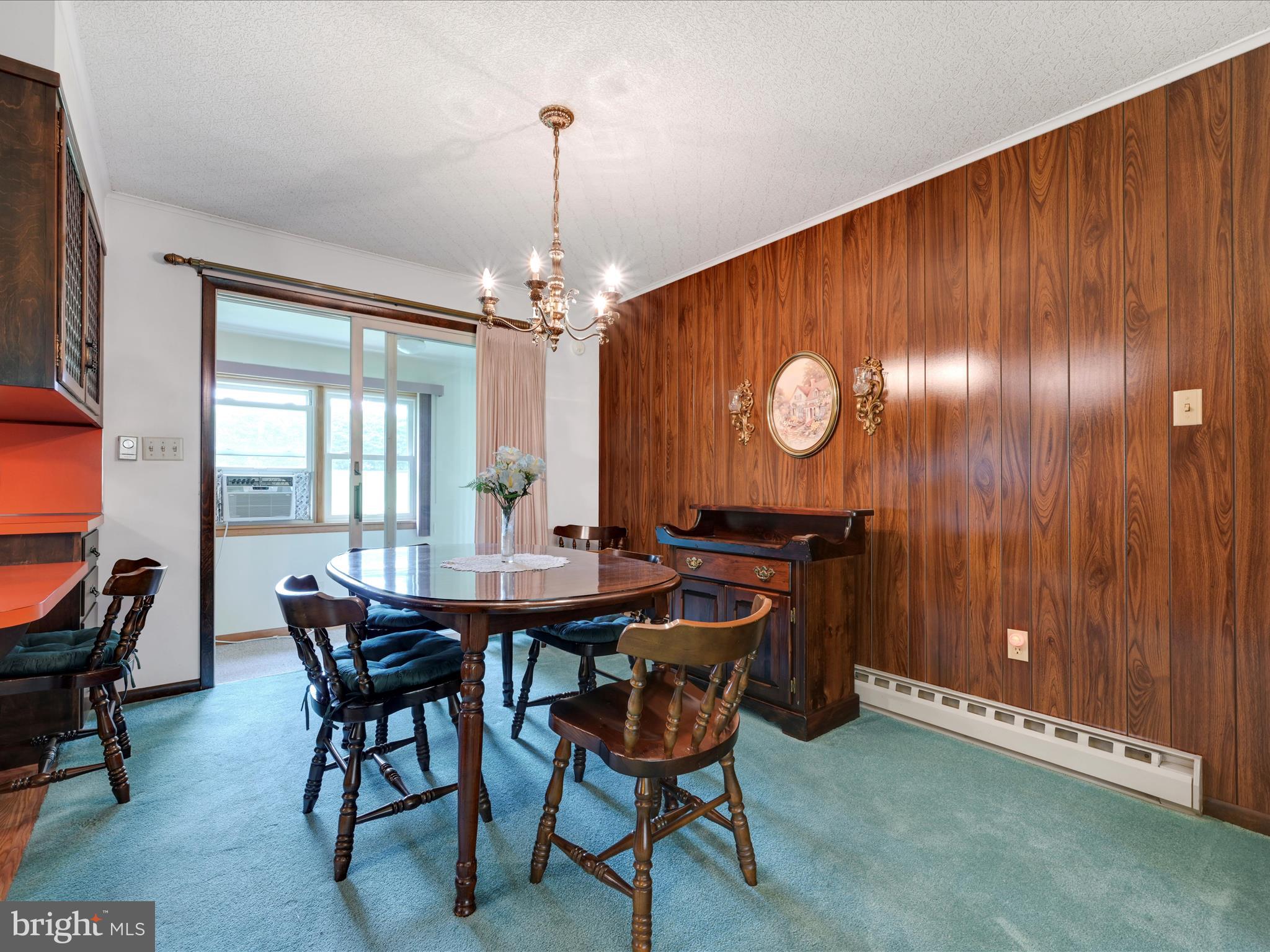858 Hill Road Ashland, PA 17921 - Photo 7 of 41 a view of a dining room with furniture and chandelier