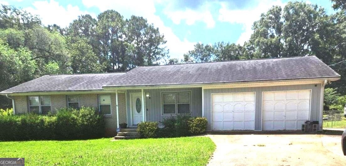 106 Stillwater Road Stockbridge, GA 30281 - Photo 1 of 1 a front view of a house with garden