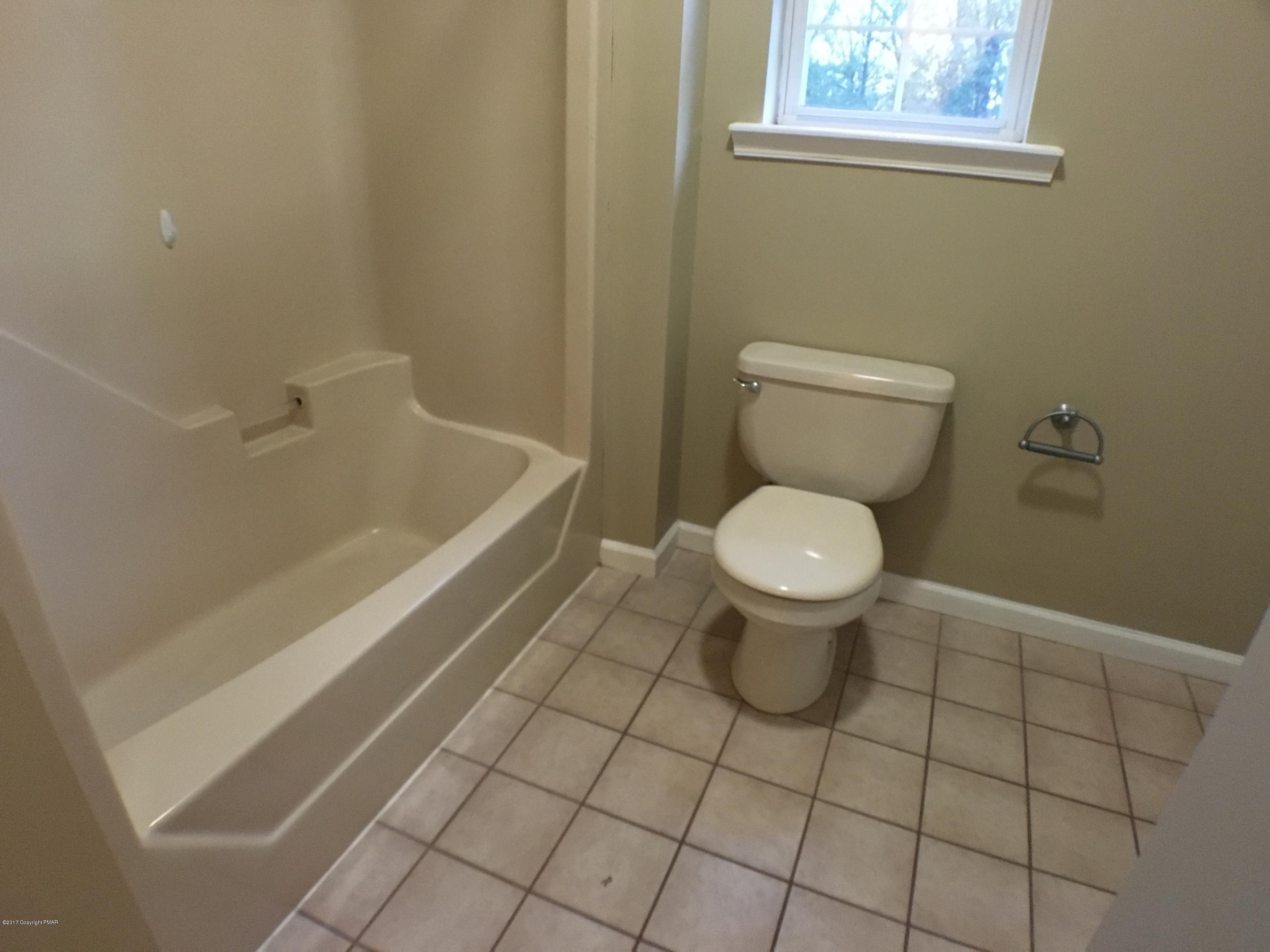 2185 Hill Road Effort, PA 18330 - Photo 13 of 17 a bathroom with a toilet and a tub