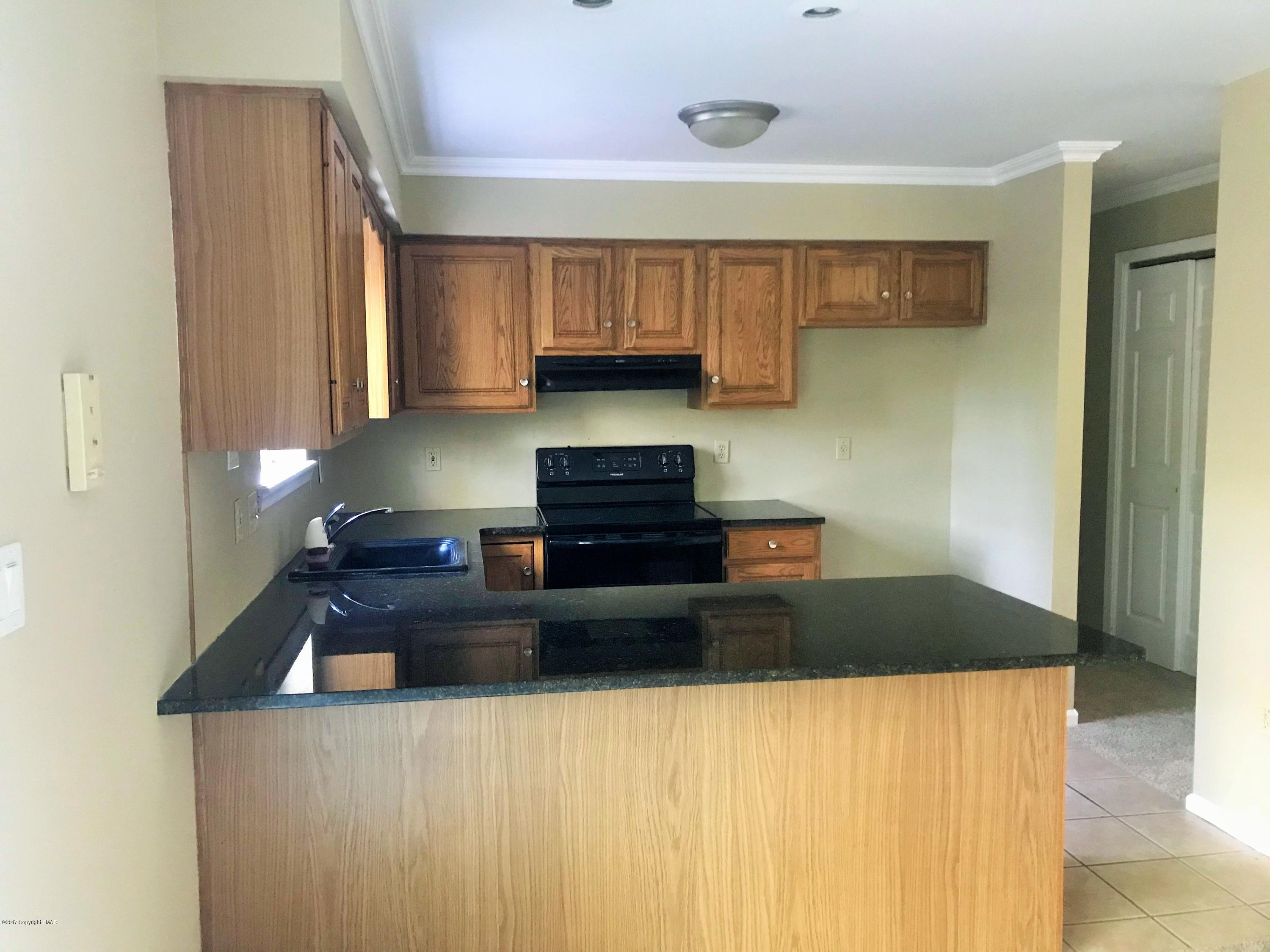 2185 Hill Road Effort, PA 18330 - Photo 15 of 17 a kitchen with a sink and a refrigerator