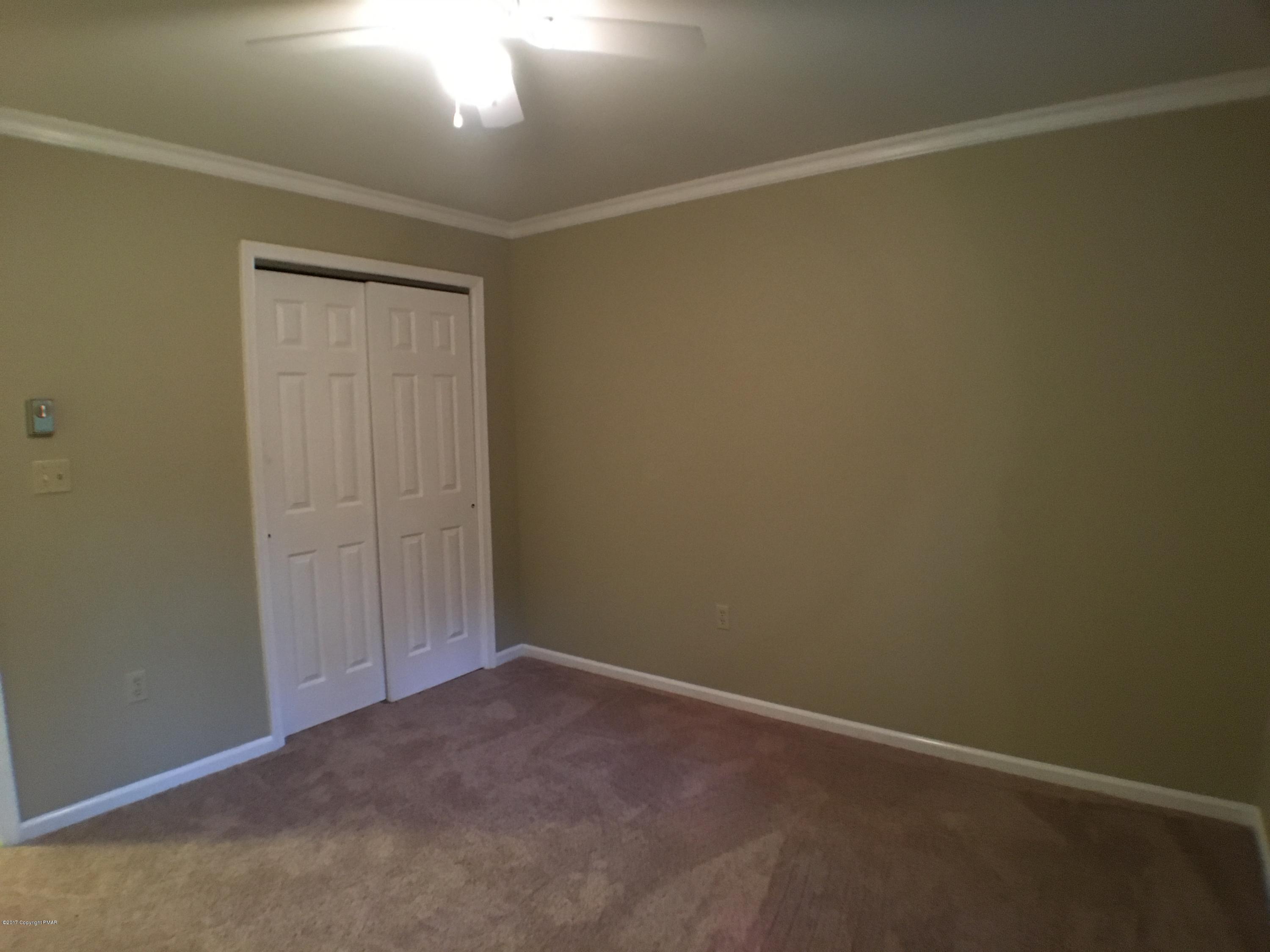 2185 Hill Road Effort, PA 18330 - Photo 8 of 17 an empty room with a hallway