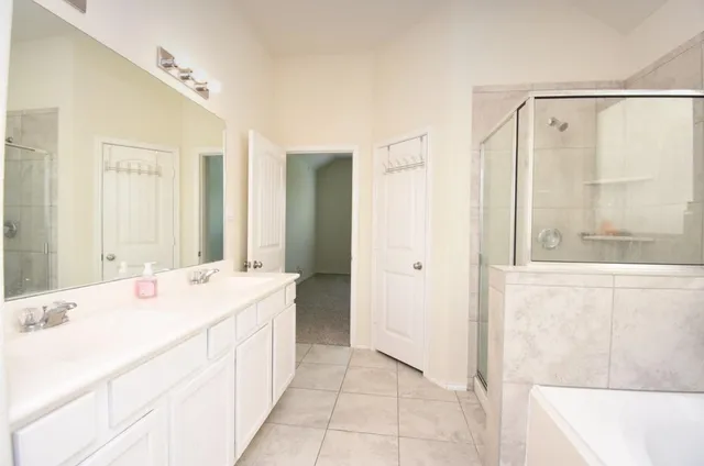a view of staircase with white walls and white door