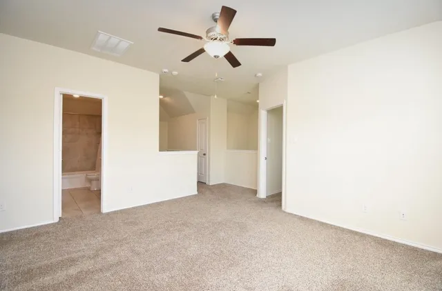 a view of a room that has a window in it