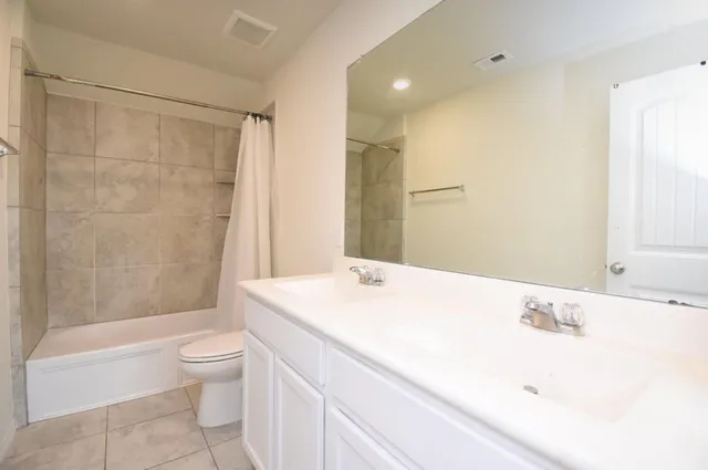 a bathroom with a bathtub and a toilet