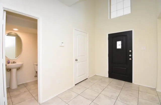 a view of a bathroom from the hallway