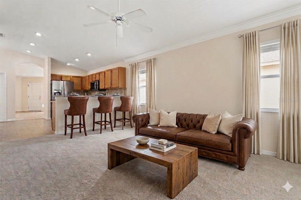 25932 Terrawood Loop Land O Lakes, FL 34639 - Photo 11 of 28 a living room with furniture and wooden floor