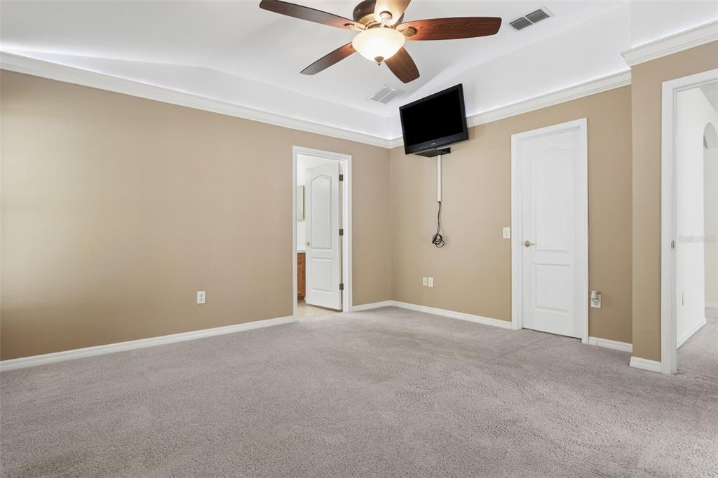 25932 Terrawood Loop Land O Lakes, FL 34639 - Photo 19 of 28 en empty room with ceiling fan and window