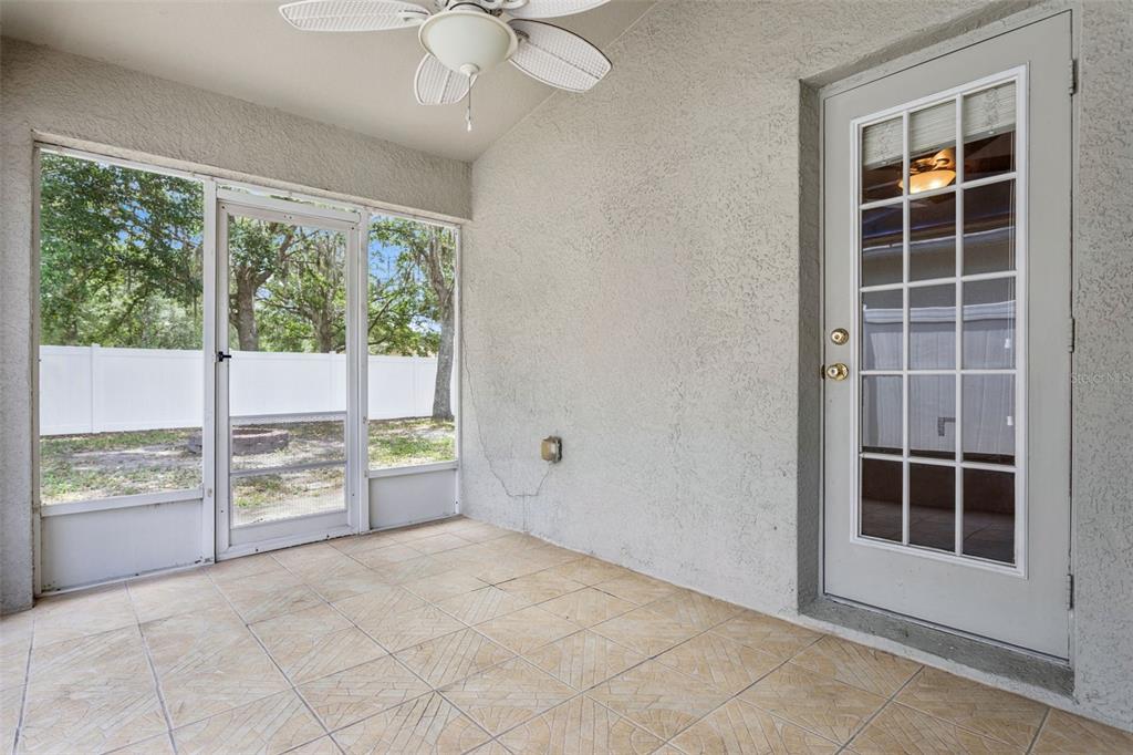 25932 Terrawood Loop Land O Lakes, FL 34639 - Photo 24 of 28 an empty room with windows lake and mountain view