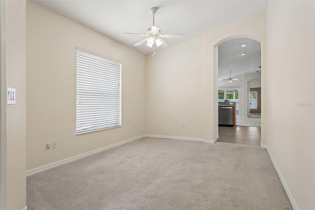 25932 Terrawood Loop Land O Lakes, FL 34639 - Photo 4 of 28 an empty room with windows and entrance