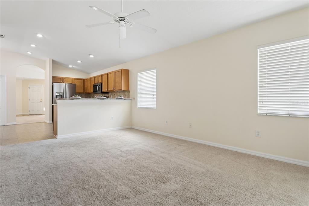25932 Terrawood Loop Land O Lakes, FL 34639 - Photo 9 of 28 an empty room with a kitchen and a window