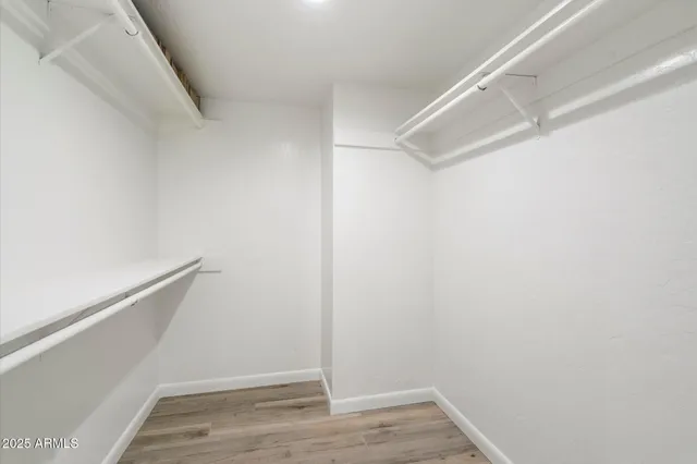 a view of an empty walk in closet