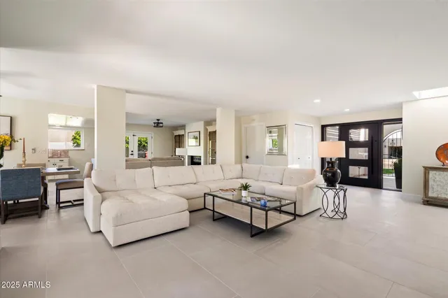 a living room with furniture and white walls