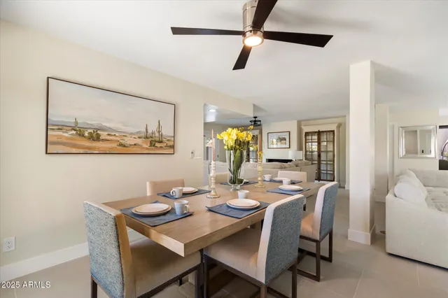 a view of a dining room with furniture and chandelier