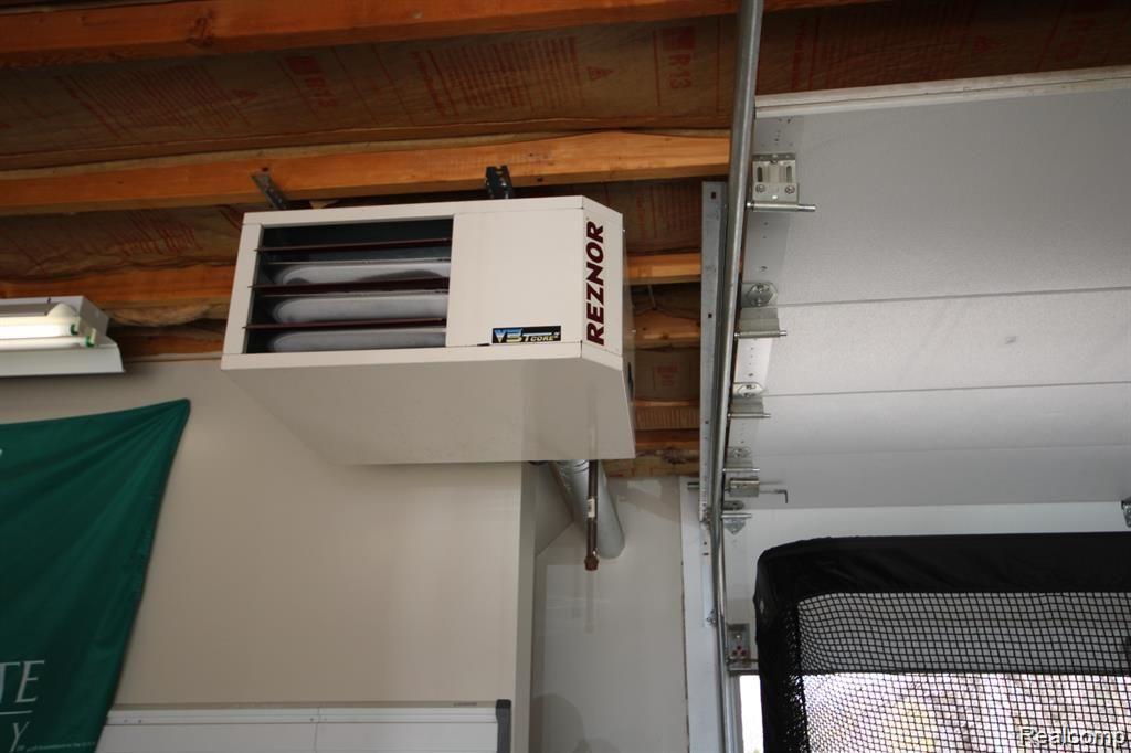 468 West 14 Mile Road Clawson, MI 48017 - Photo 22 of 24 Efficient gas furnace in garage makes it usable year-round for hobbies, recreation, or party use.