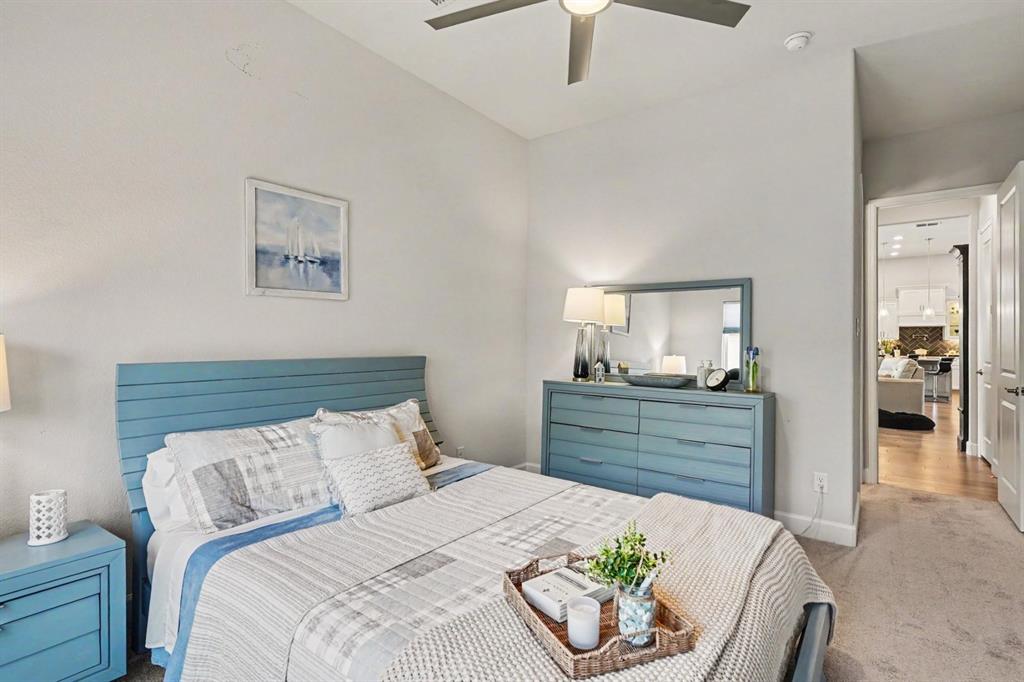 573 Broadleaf Way Haslet, TX 76052 - Photo 22 of 35 a bedroom with a bed and a dresser