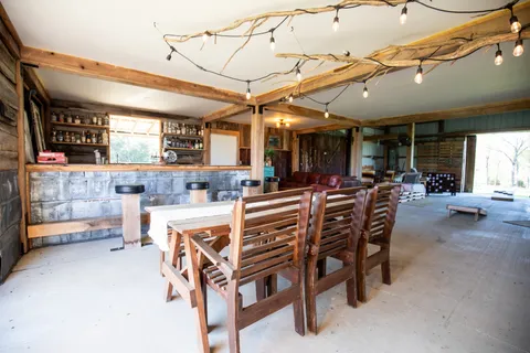 a view of a chairs and tables in a patio