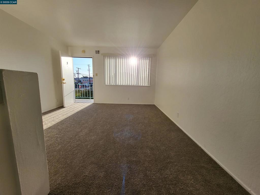 2488 Market Avenue San Pablo, CA 94806 - Photo 2 of 4 a view of an empty room with a window