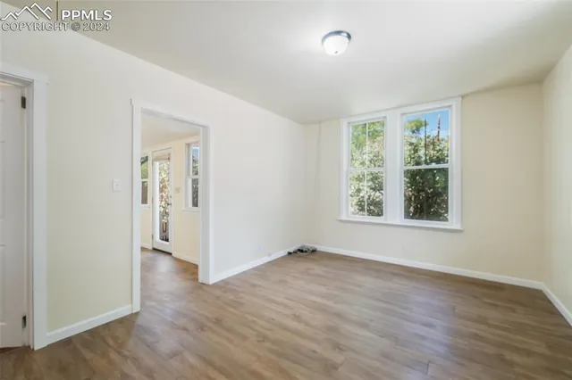 a view of kitchen with wooden floor and window
