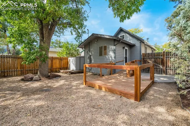 a backyard of a house with seating space