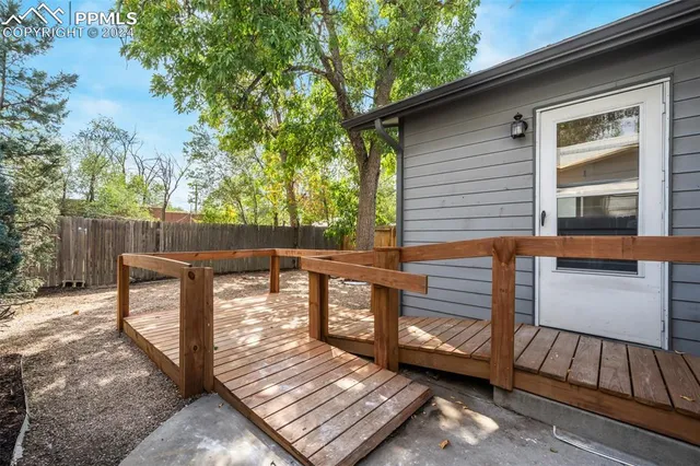 a view of a house with a backyard and a garage